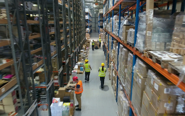 Man and woman working in a warehouse. Aerial view